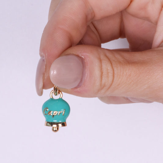 Metal pendant with turquoise bell written Capri