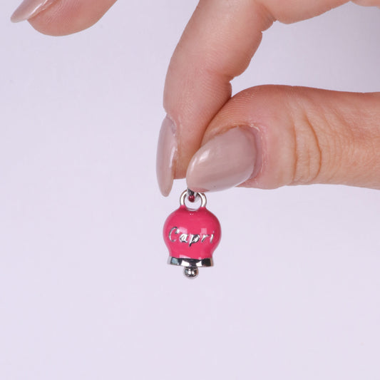 Metal pendant with magenta bell written Capri