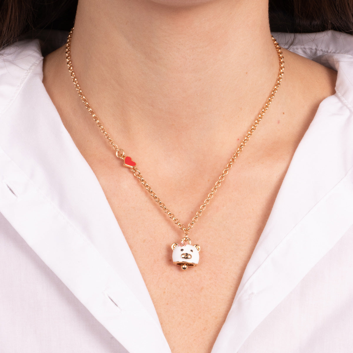 Metal necklace with bell in the shape of a white bear and a red heart