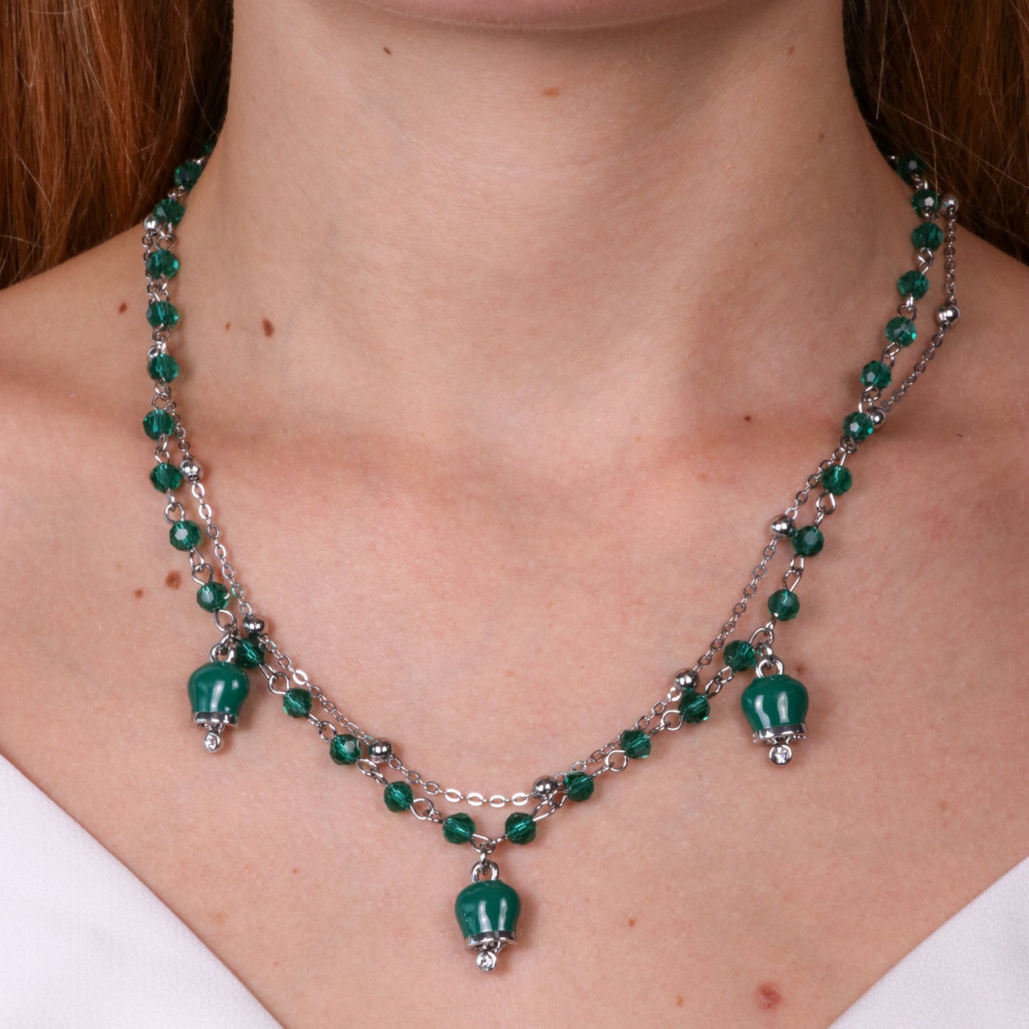 Metal necklace with multi-strand green bells