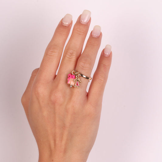 Anello in Metallo con campanella rosa e fiocco centrale con pendenti a forma di bimba