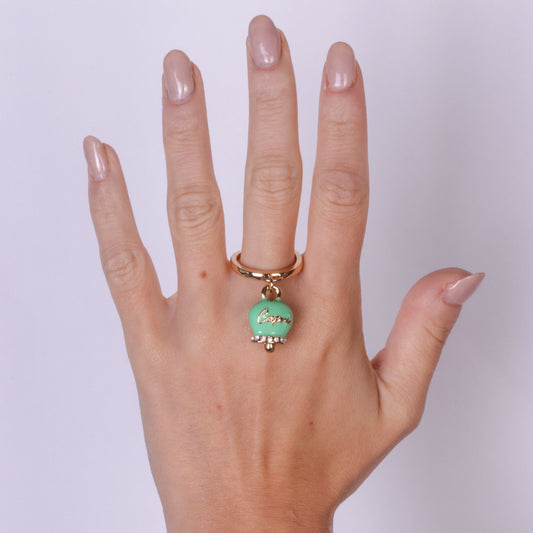 Metal ring with green bell written Capri