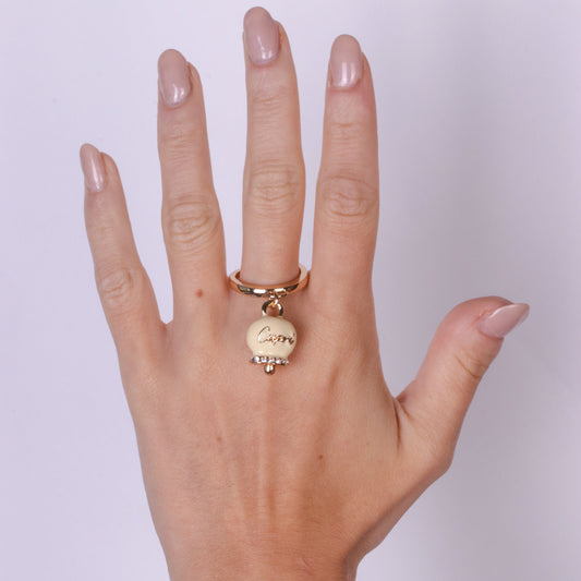 Metal ring with cream bell written Capri