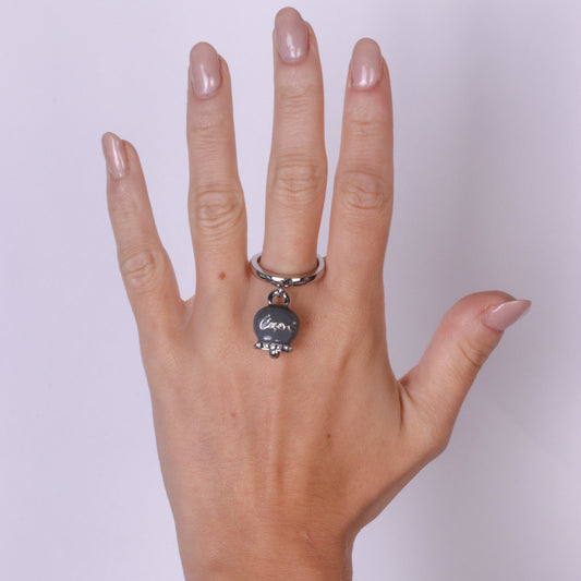 Metal ring with gray bell written Capri