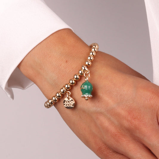 Bracciale in Metallo con campanella scritta capri pendente impreziosita da cristalli e smalto verde