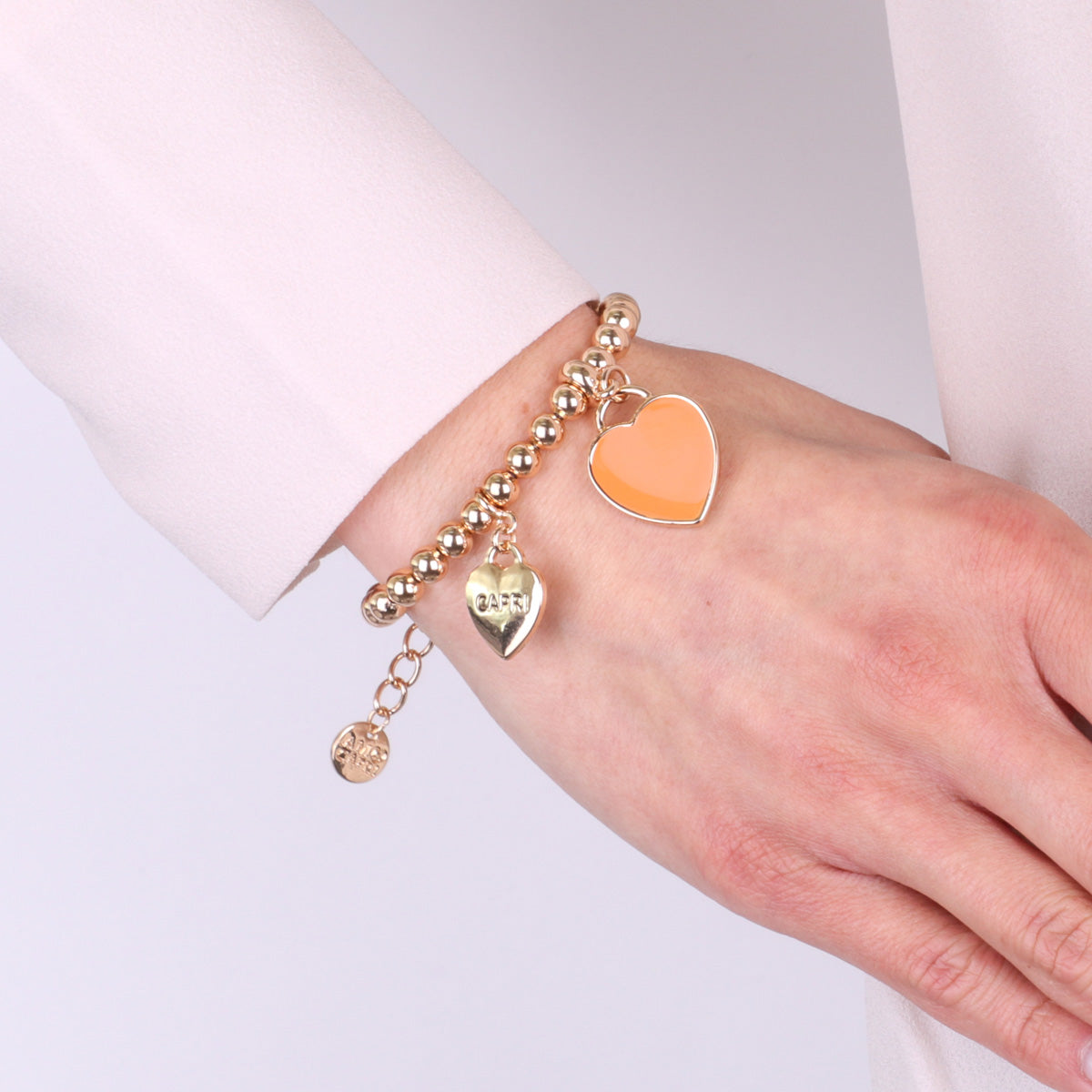 Bracciale in Metallo con cuore arancione pendente