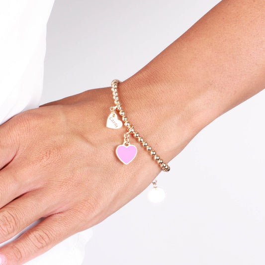 Metal bracelet with pink heart