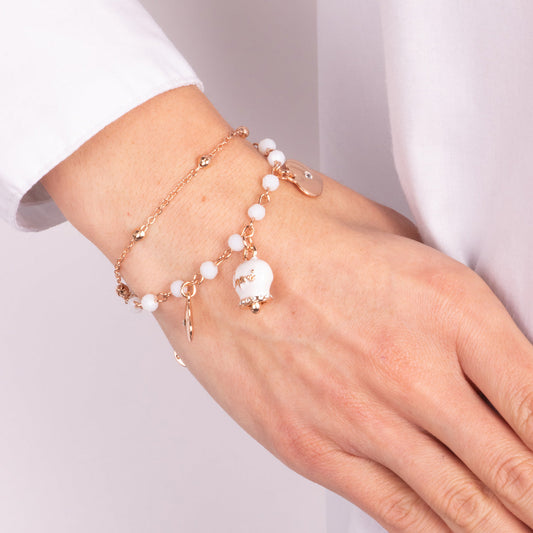 Multi-strand metal bracelet with white stones and white Capri bell