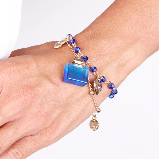 Metal bracelet with perfume and blue stones