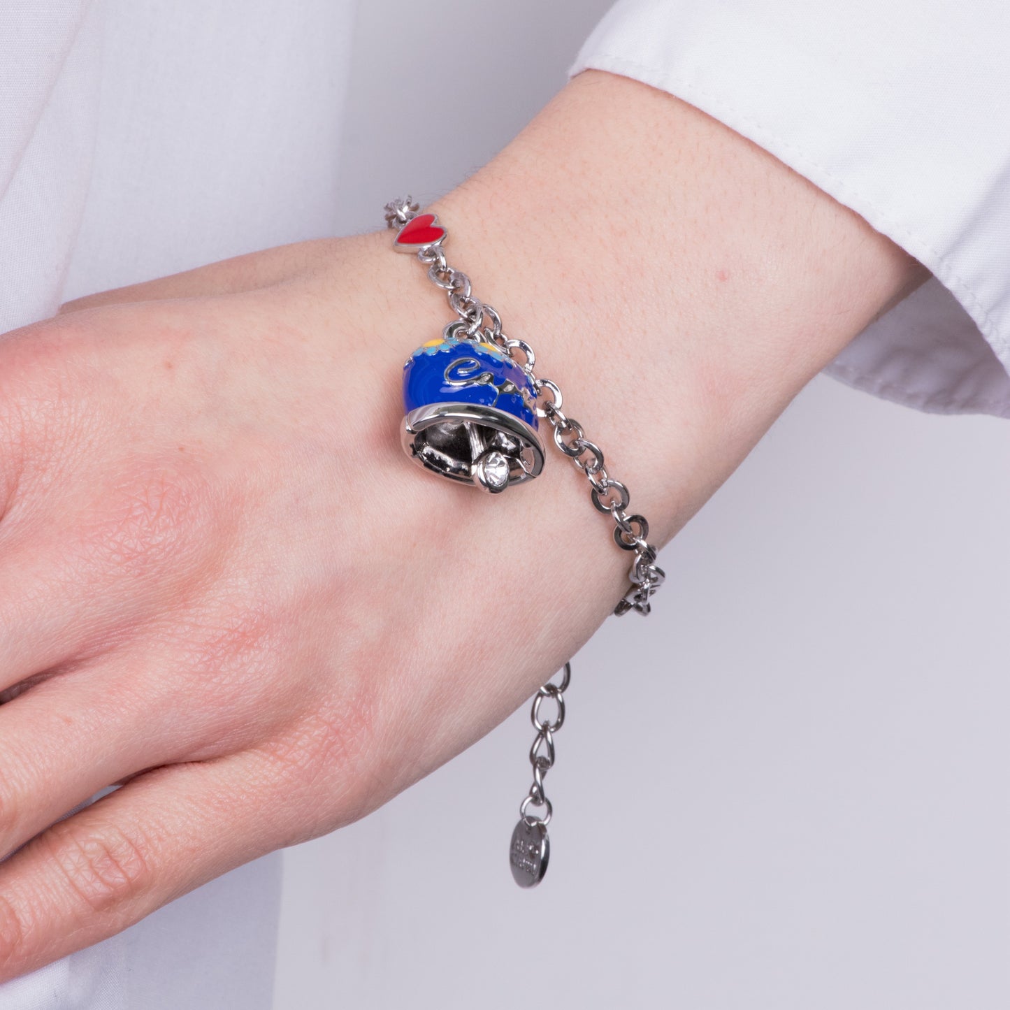 Metal bracelet with blue bell embellished with daisies and Capri writing