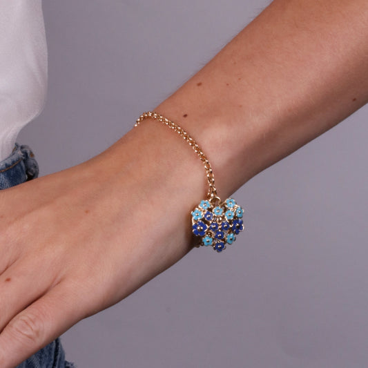 Heart metal bracelet embellished with blue flowers