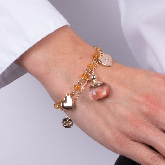 Metal bracelet with pink perfume for yellow stones